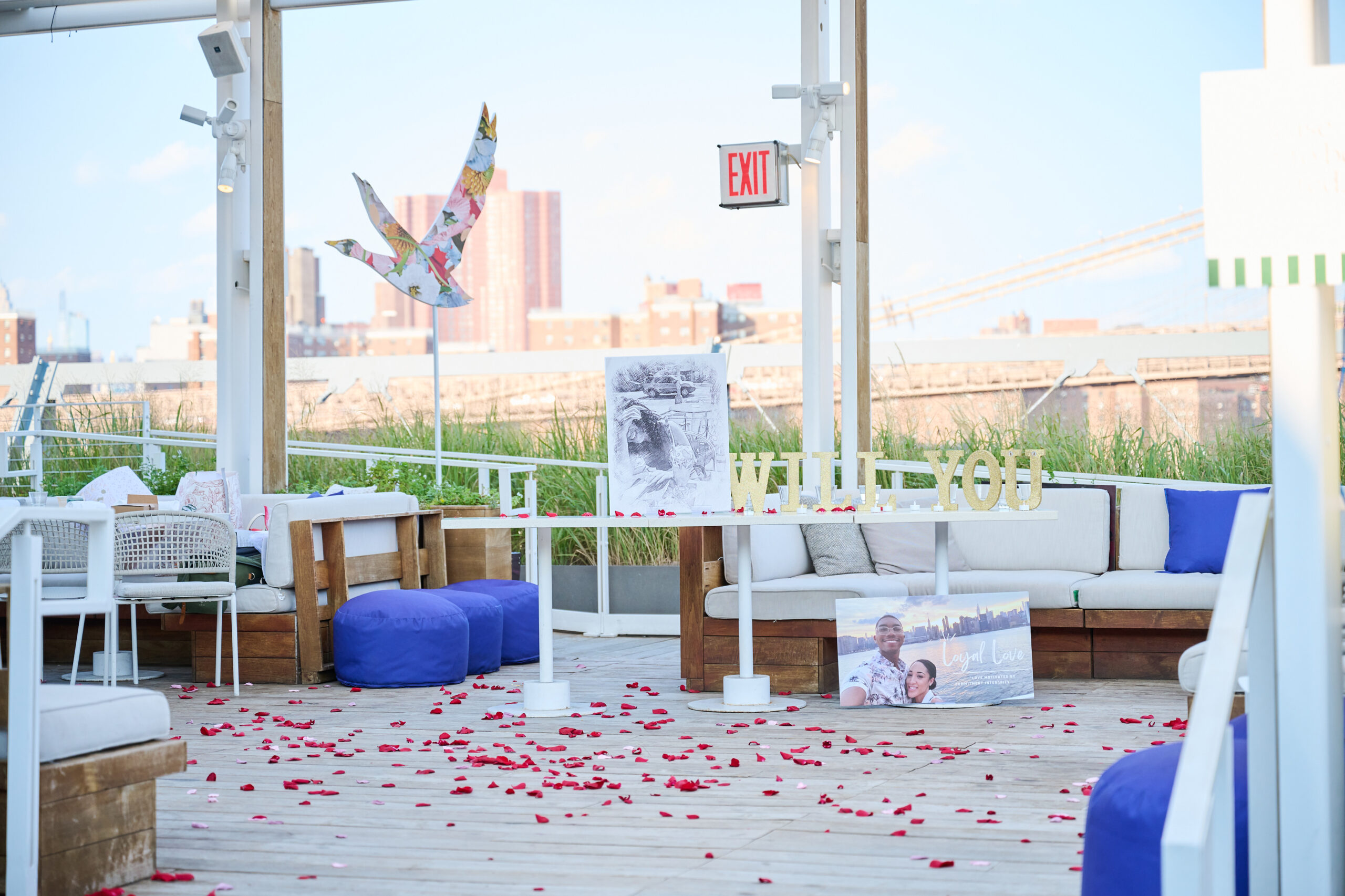 Stunning Decorations for a Marriage Proposal at the Pier 17 Rooftop; Brooklyn Bridge can be seen in the background.