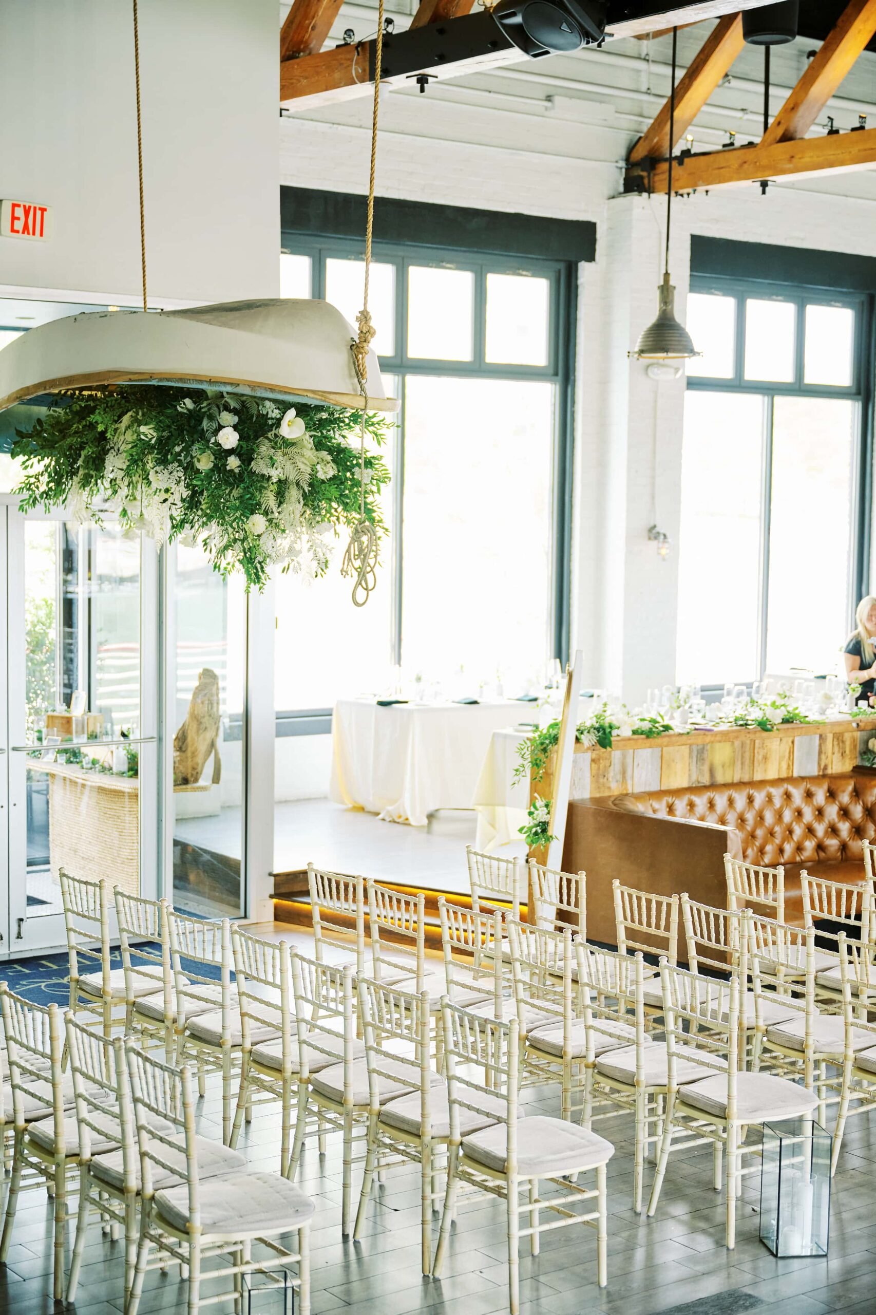 Ceremony Space filled with Floral Arrangements inside the Battello Wedding Venue in Jersey City