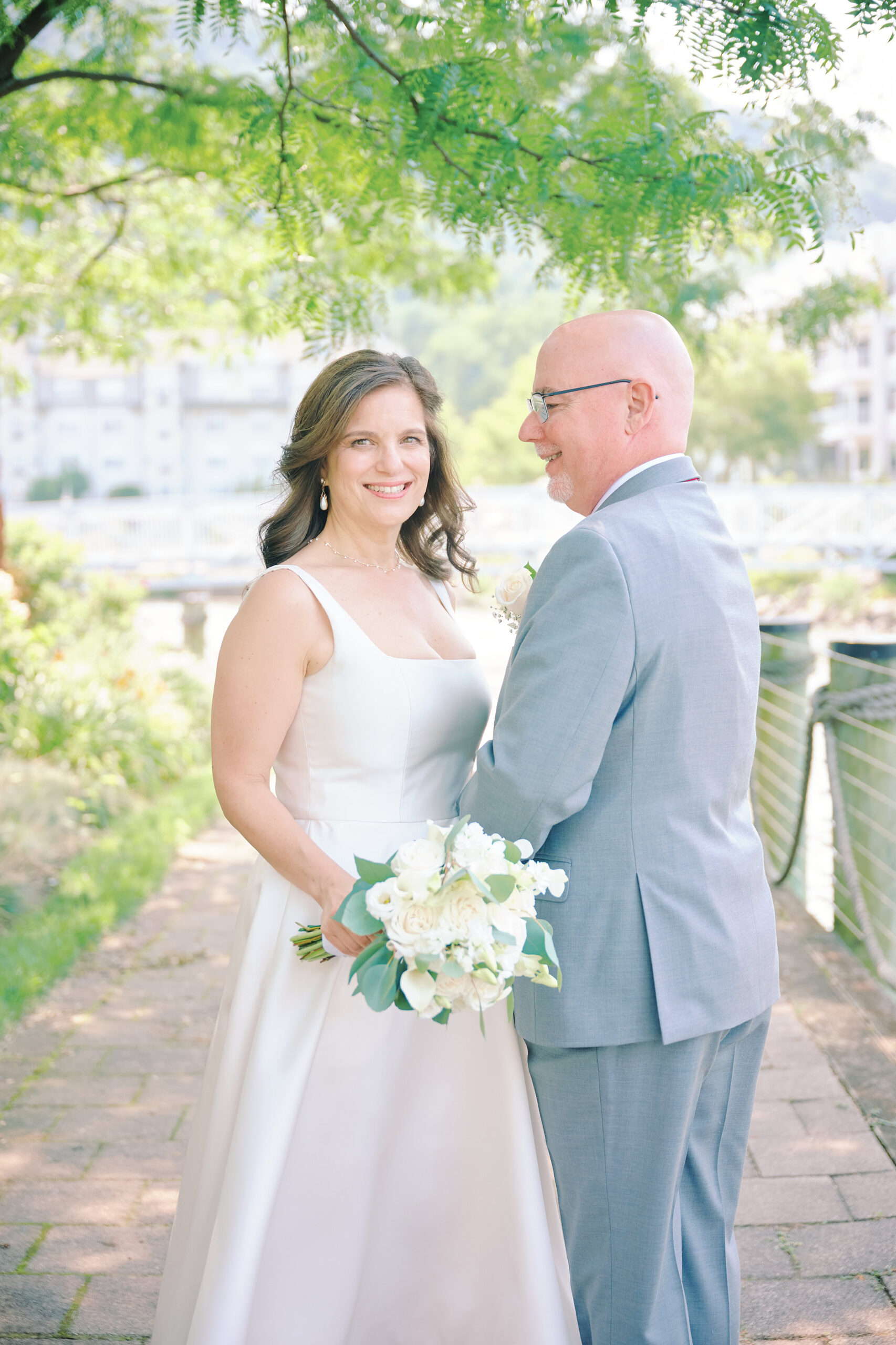 Bride & Groom Portraits before their Ceremony in Hudson Valley.
Bride looks at Camera while Groom looks at bride