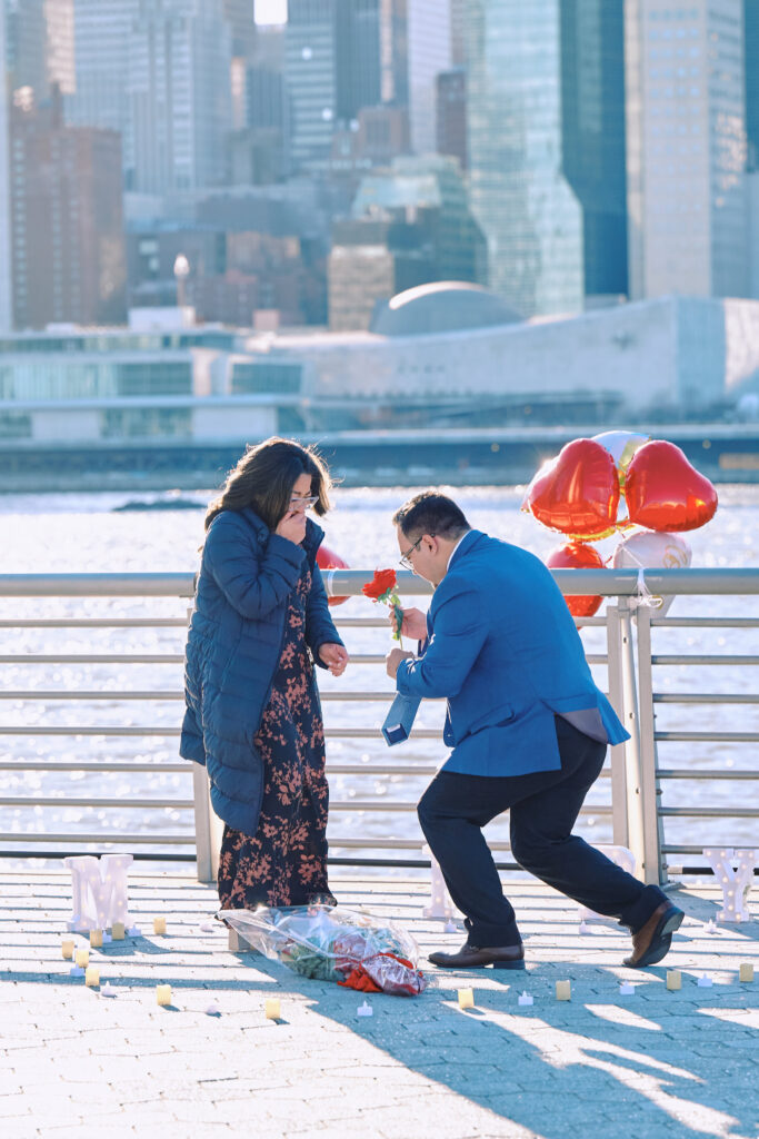 Man gets on Bended knee to Propose, NYC skyline is in view