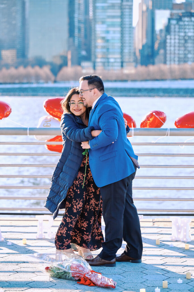 A tearful embrace after a successful New York City Proposal at Gantry State Plaza Park