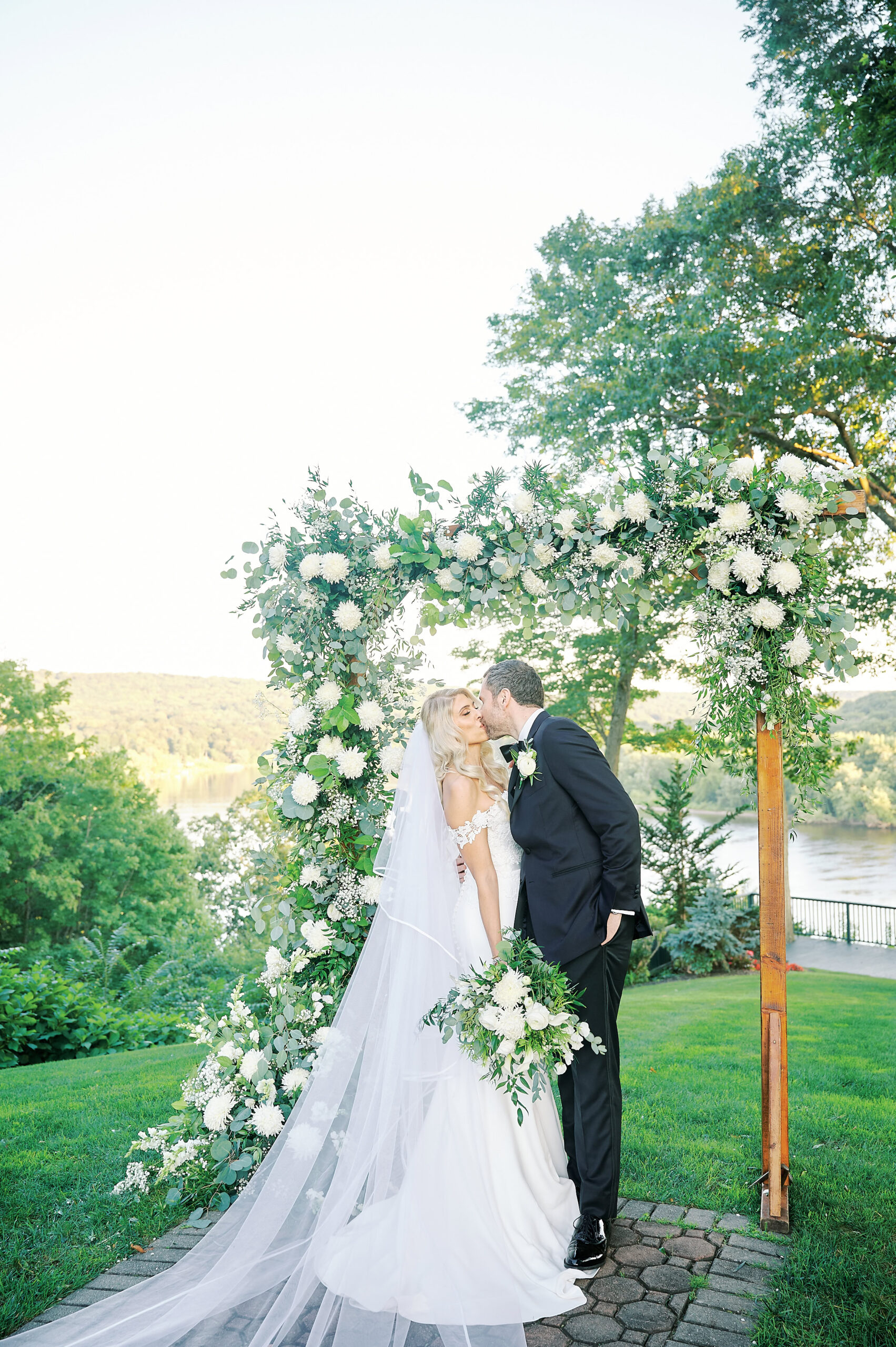 Groom Dips Bride while they kiss after their wedding Ceremony at the Saint Clements Castle and Marina. Photo taken by New York City Wedding Photographer Corey Lamar Photography