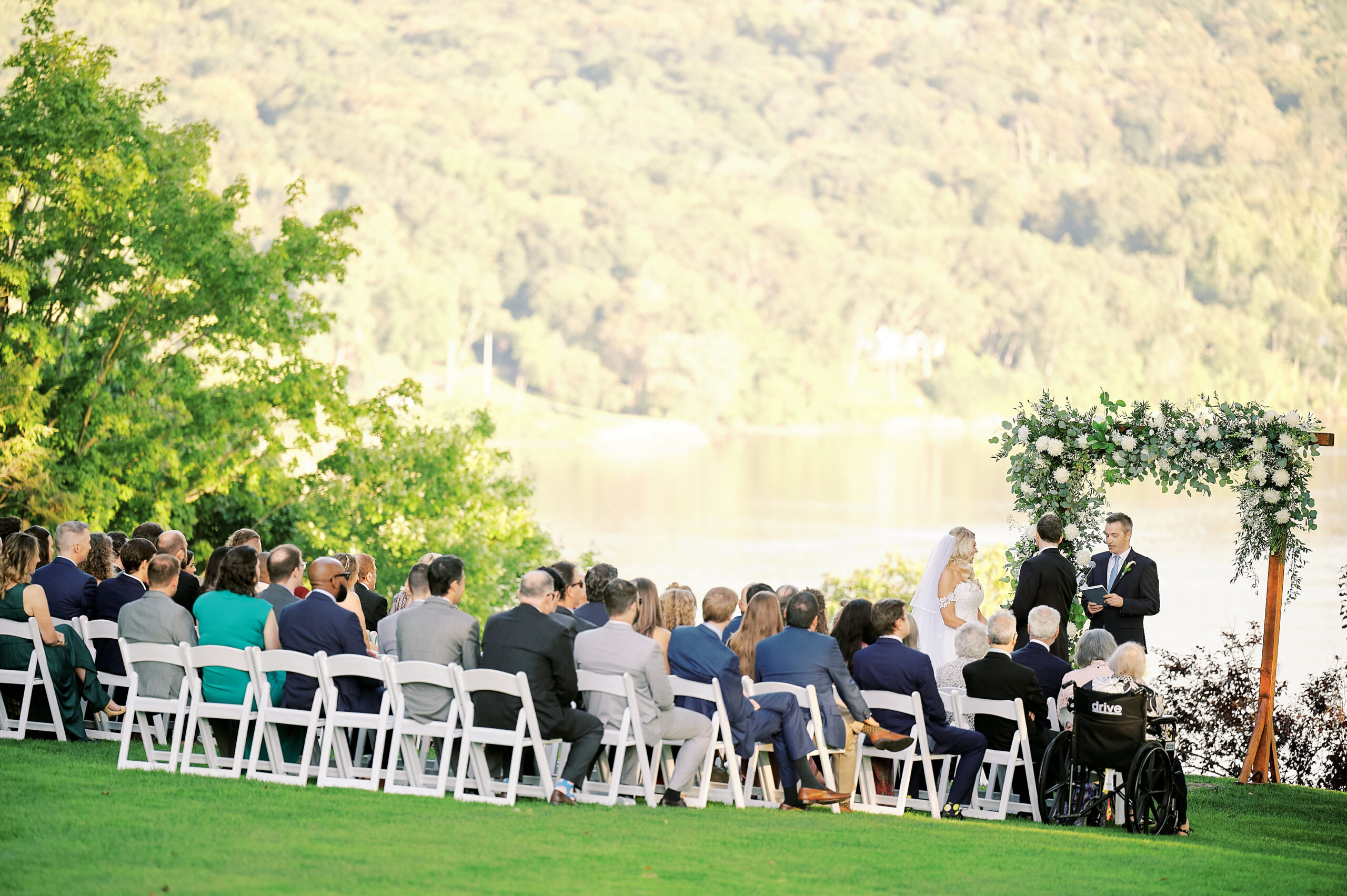 Outdoor Wedding Ceremony in place at the Saint Clements Castle, in the Sunken Garden.  Bride and Groom are waiting to exchange their wedding vows.  Image taken by New York City Wedding Photographer Corey Lamar Photography