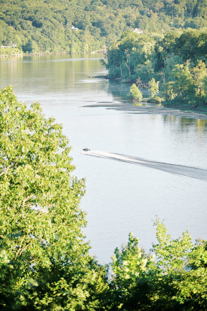 Image of the Connecticut River, where a boat can see cruising by.  View is seen off of the Saint Clements and Marina 90 acre Estate